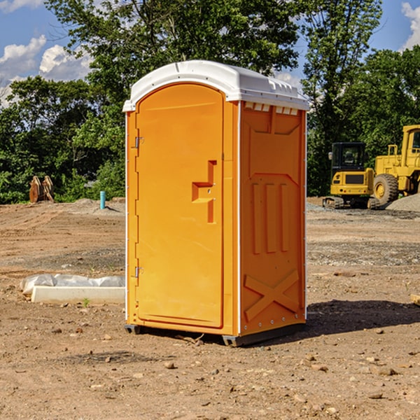 what is the cost difference between standard and deluxe portable restroom rentals in Jackson County